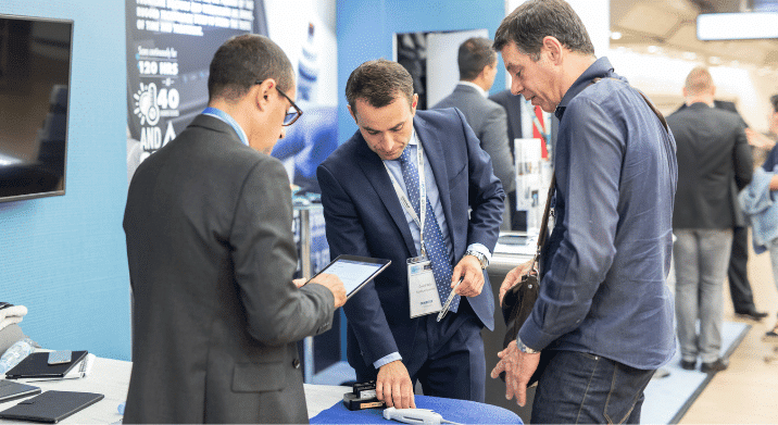 People using iPads at a tradeshow